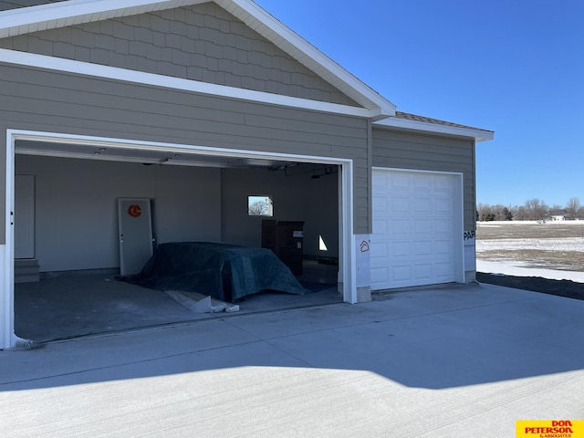 garage with concrete driveway