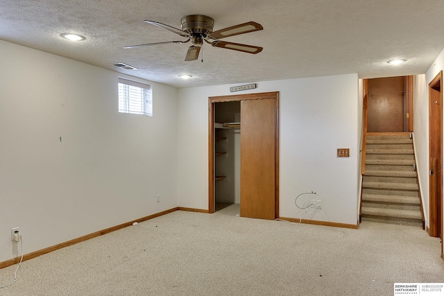 unfurnished bedroom with baseboards, visible vents, carpet floors, and a textured ceiling