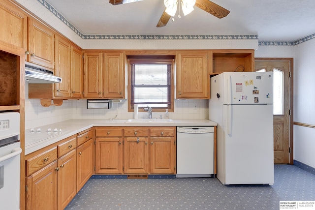 kitchen featuring under cabinet range hood, open shelves, a sink, white appliances, and light countertops