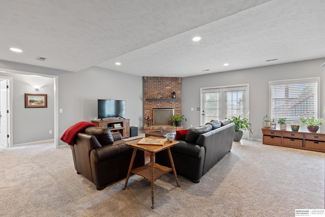 living area with a fireplace, recessed lighting, light carpet, a textured ceiling, and baseboards