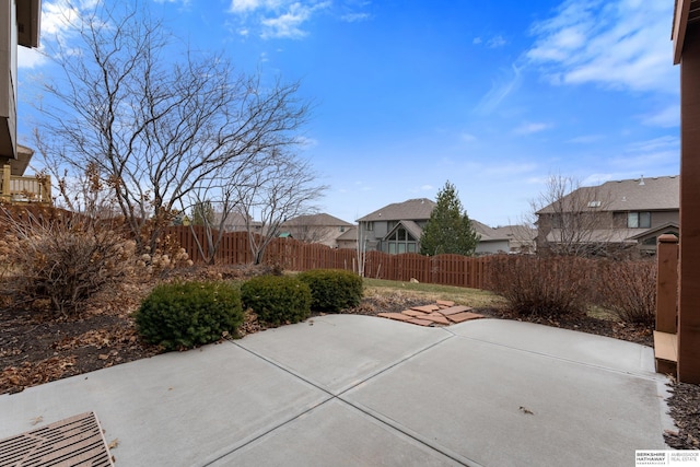 view of patio / terrace featuring a residential view and fence