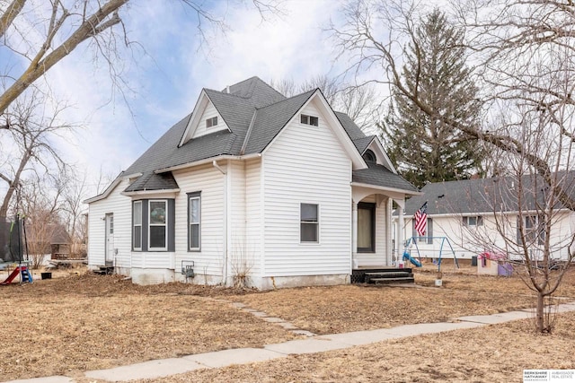 view of front of home with a shingled roof