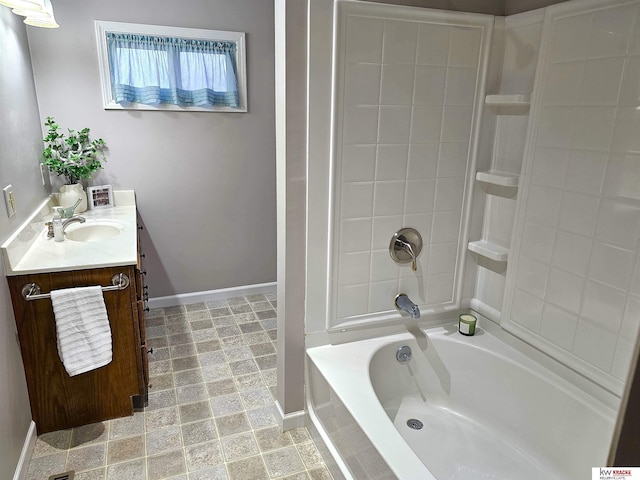 bathroom with baseboards, bathtub / shower combination, and vanity