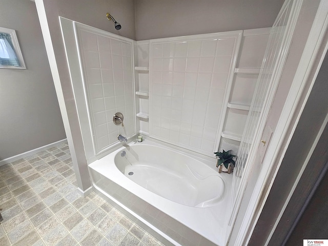 bathroom featuring  shower combination and baseboards