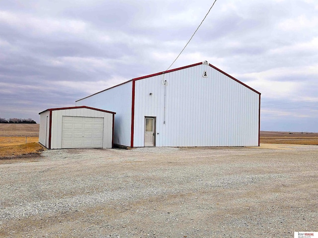 view of outbuilding featuring an outbuilding and driveway