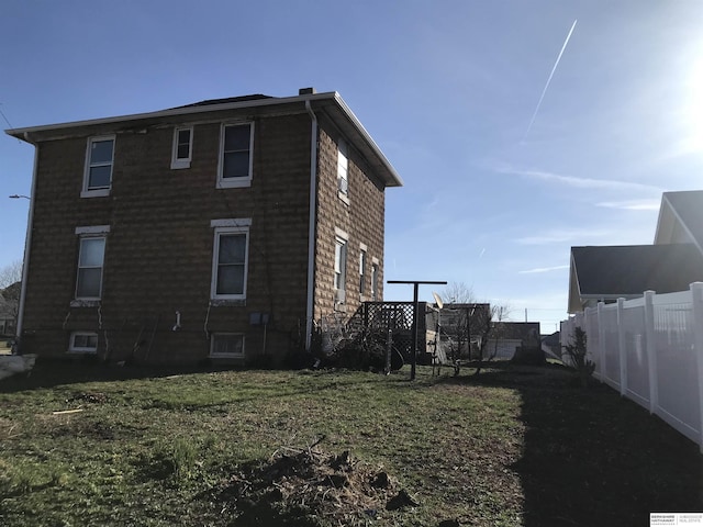 view of property exterior with fence