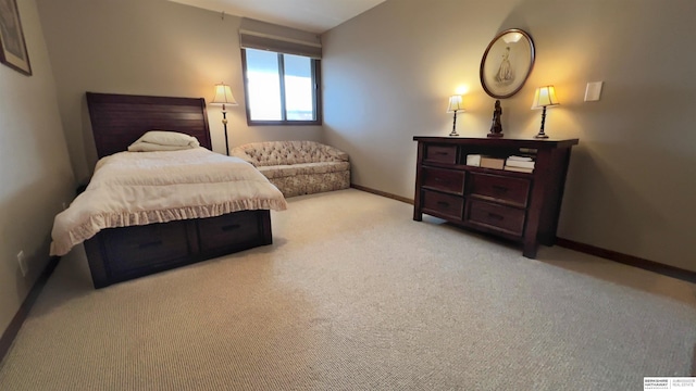 carpeted bedroom with baseboards