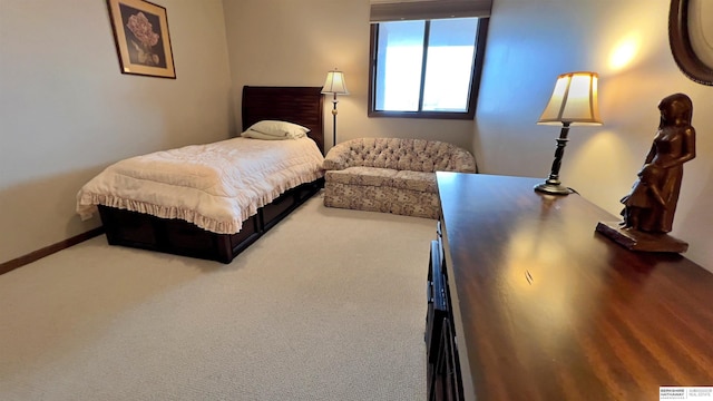 bedroom featuring carpet floors and baseboards