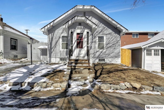 view of front of home featuring an outdoor structure