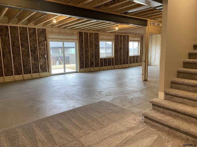 interior space featuring plenty of natural light and stairway