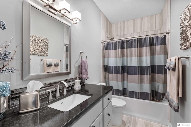 6919 Wildrye Rd, Lincoln, NE 68521 - full bathroom featuring vanity, shower / bath combo with shower curtain, and toilet