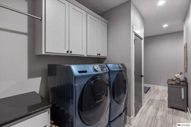 6919 Wildrye Rd, Lincoln, NE 68521 - washroom with cabinet space, baseboards, separate washer and dryer, and recessed lighting