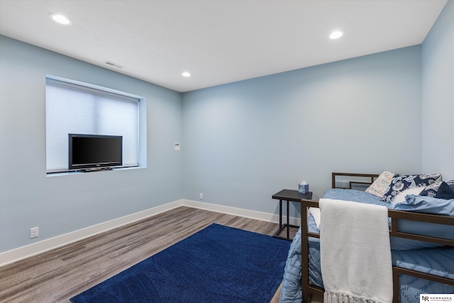 6919 Wildrye Rd, Lincoln, NE 68521 - bedroom with visible vents, baseboards, wood finished floors, and recessed lighting