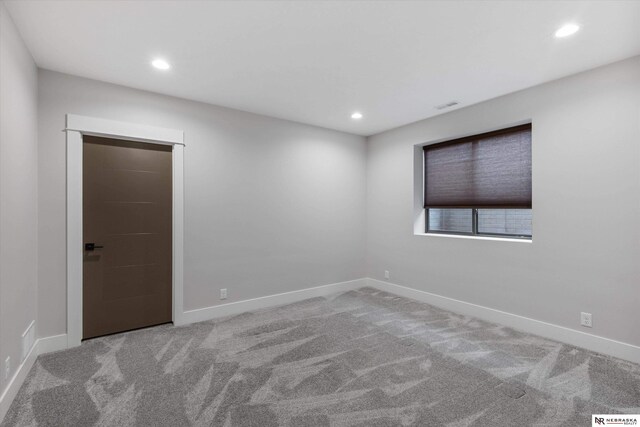6919 Wildrye Rd, Lincoln, NE 68521 - empty room with carpet floors, baseboards, visible vents, and recessed lighting