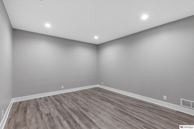 6919 Wildrye Rd, Lincoln, NE 68521 - empty room with recessed lighting, visible vents, baseboards, and wood finished floors