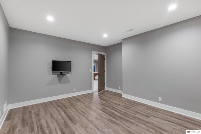 6919 Wildrye Rd, Lincoln, NE 68521 - empty room with recessed lighting, visible vents, baseboards, and wood finished floors