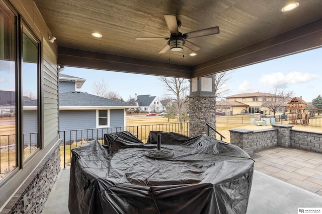 6919 Wildrye Rd, Lincoln, NE 68521 - view of patio featuring ceiling fan and a residential view