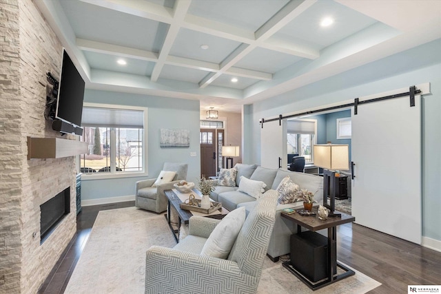 6919 Wildrye Rd, Lincoln, NE 68521 - living room featuring a barn door, coffered ceiling, wood finished floors, and a wealth of natural light