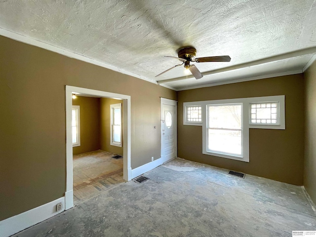 unfurnished room with visible vents and a textured ceiling