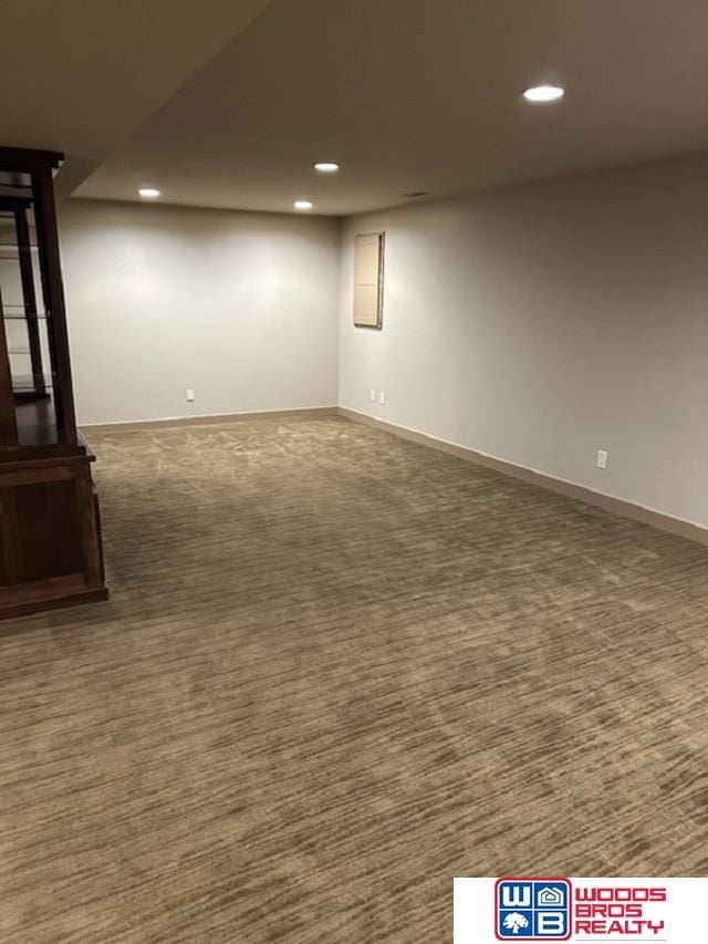 finished basement featuring carpet, baseboards, and recessed lighting