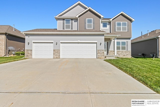 craftsman-style house featuring stone siding, a front lawn, and concrete driveway