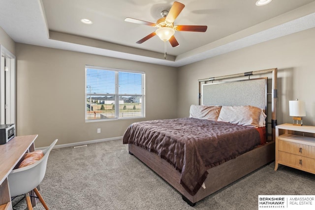 carpeted bedroom with baseboards, a tray ceiling, a ceiling fan, and recessed lighting