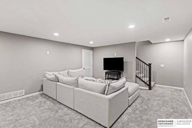 living room with carpet floors, recessed lighting, visible vents, stairway, and baseboards