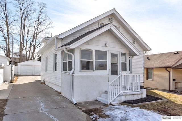 view of front of home with an outbuilding and a detached garage