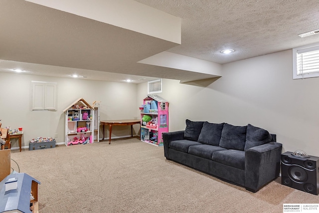 game room with baseboards, visible vents, a textured ceiling, carpet flooring, and recessed lighting