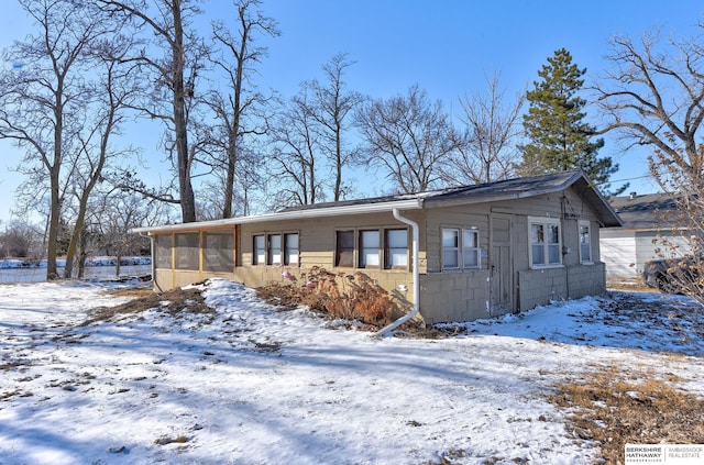 view of front of house with a sunroom