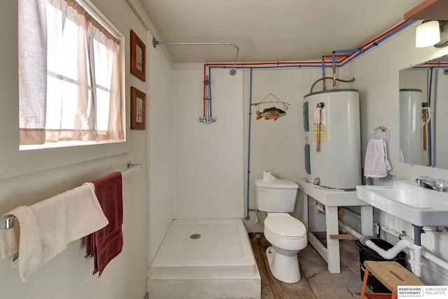 full bathroom with electric water heater, a sink, a shower stall, and toilet