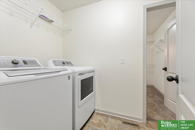 laundry area with laundry area, baseboards, visible vents, light colored carpet, and independent washer and dryer