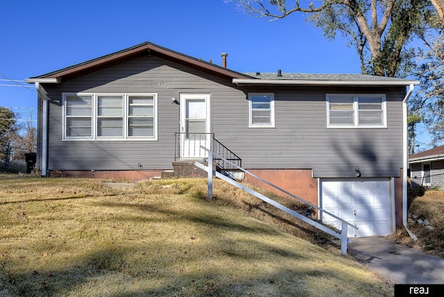 view of front facade with a garage and a front lawn