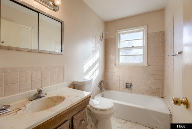 bathroom featuring shower / bathtub combination, vanity, and toilet