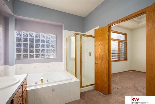 bathroom featuring vanity, a garden tub, and a stall shower