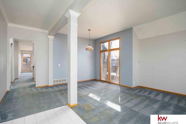 tiled spare room with arched walkways, carpet, a healthy amount of sunlight, and ornate columns