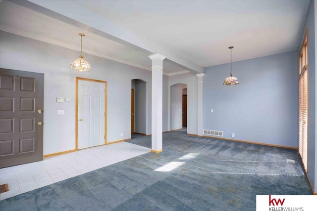 entrance foyer with visible vents, ornate columns, carpet floors, baseboards, and tile patterned flooring