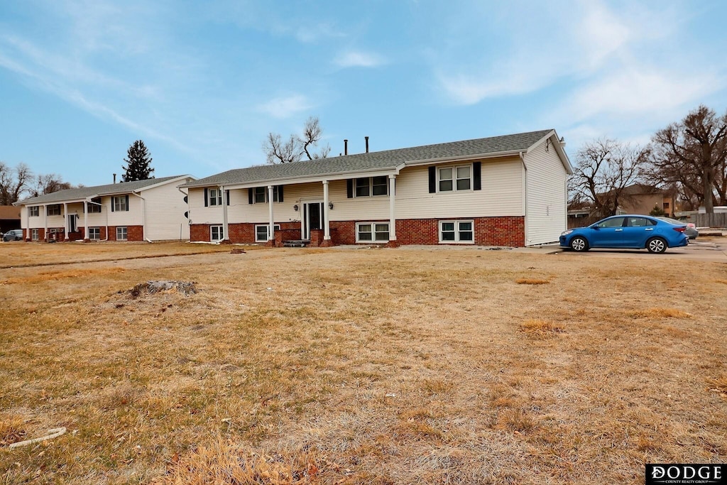 bi-level home with a front yard