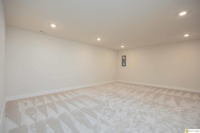 unfurnished room featuring carpet, baseboards, and recessed lighting