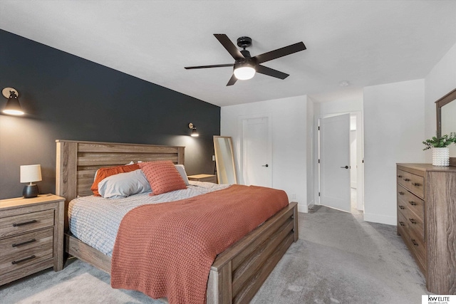 bedroom with baseboards, a ceiling fan, and light colored carpet