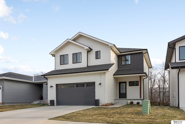 view of front of property with a shingled roof, concrete driveway, a front lawn, and an attached garage