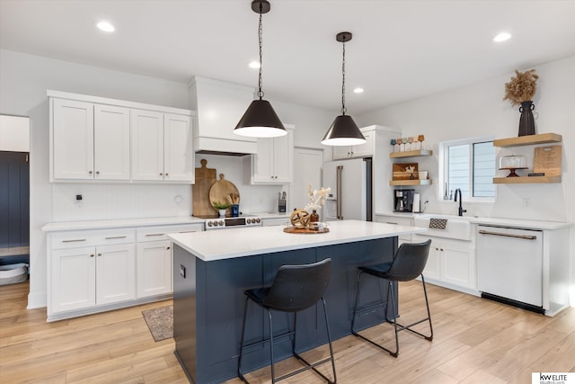 kitchen featuring open shelves, white appliances, light countertops, and white cabinets