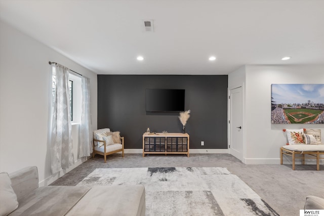 unfurnished room featuring carpet, visible vents, baseboards, and recessed lighting