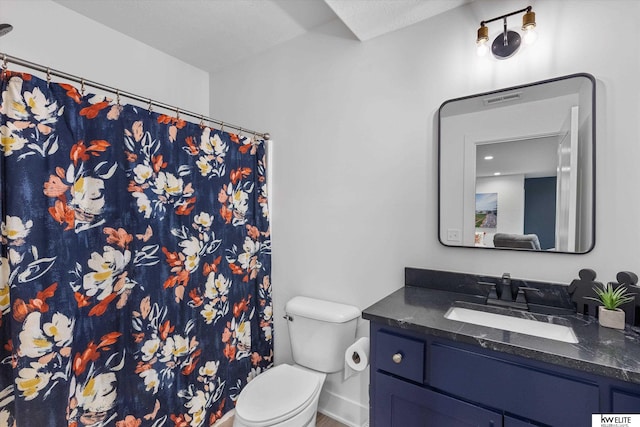 bathroom featuring visible vents, a shower with shower curtain, toilet, vanity, and baseboards