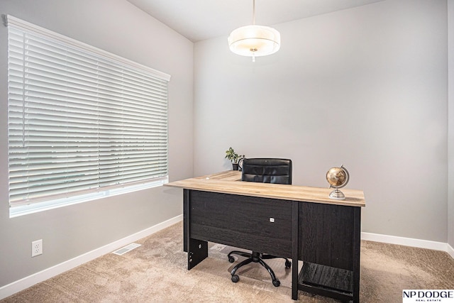 office featuring light colored carpet, visible vents, and baseboards