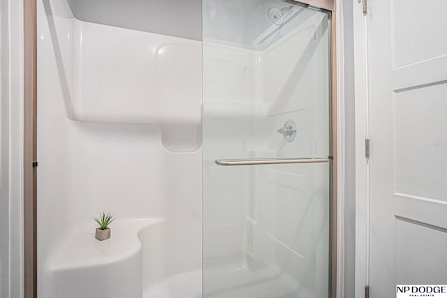 full bathroom with a stall shower