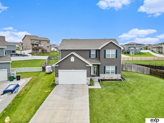 traditional-style home with a residential view, stone siding, driveway, and a front yard