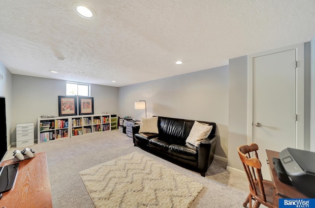 living area with a textured ceiling, carpet flooring, and recessed lighting