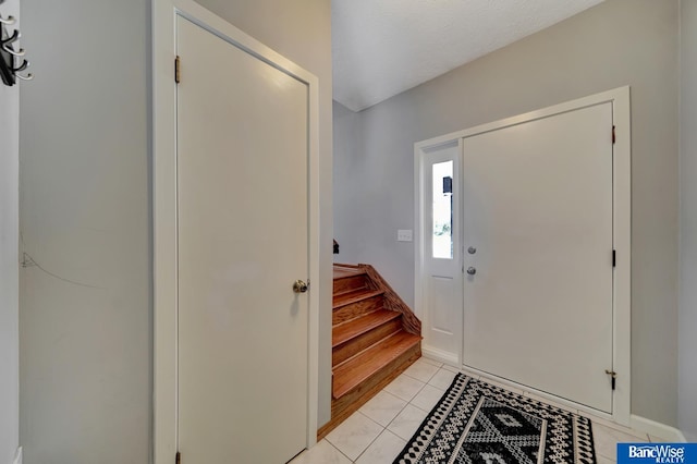 entryway featuring light tile patterned floors