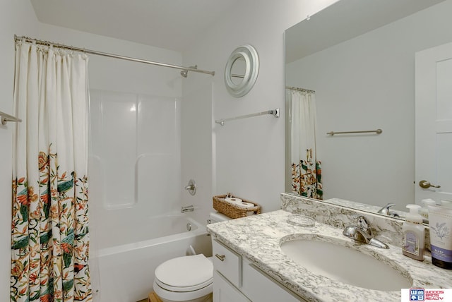 bathroom featuring toilet, shower / bath combination with curtain, and vanity